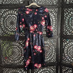 Gorgeous sequins dress with flowers. Head turning piece. NWT. Size 6.